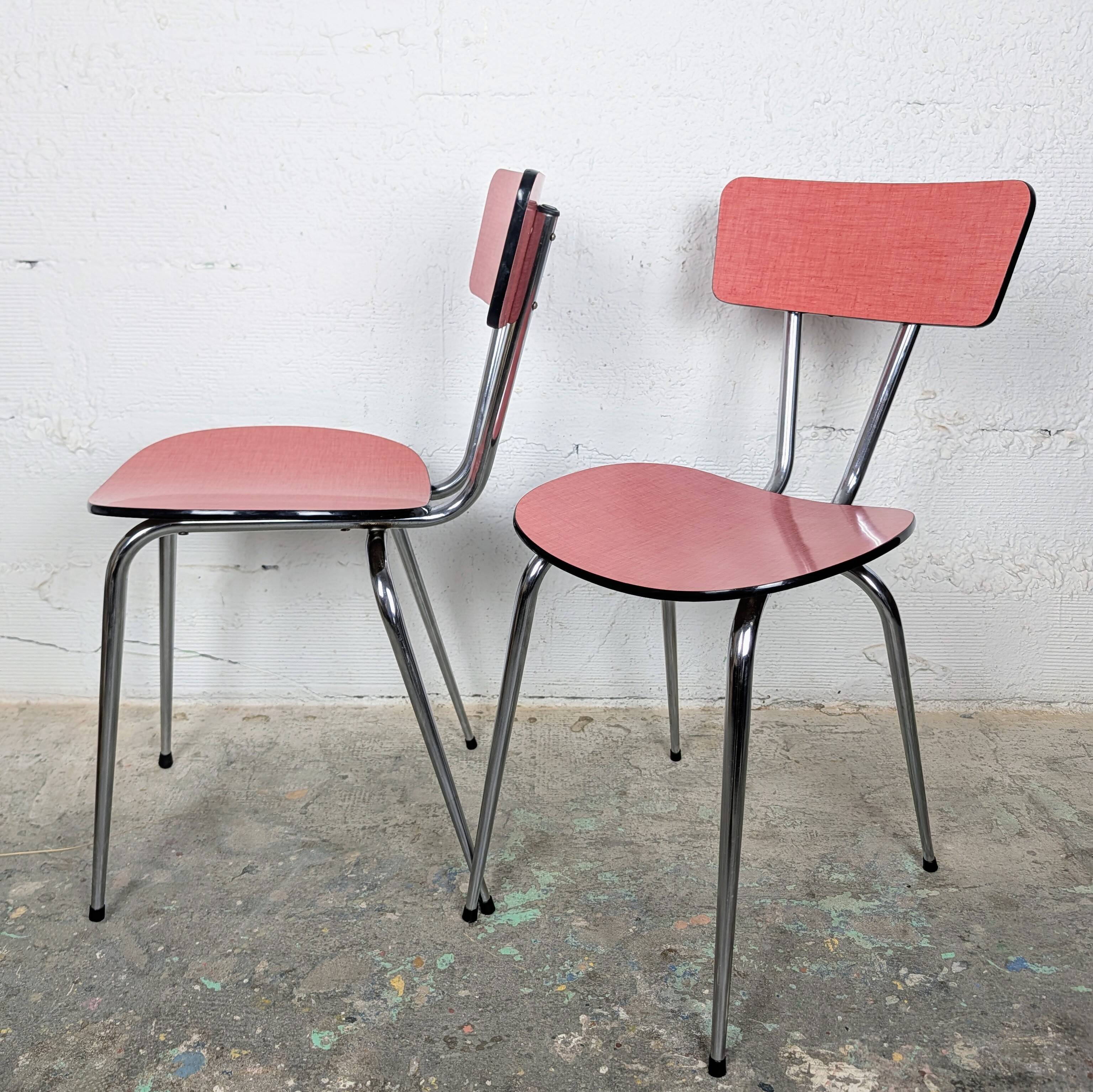 Pair of red Formica chairs with chrome legs