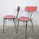 Pair of red Formica chairs with chrome legs