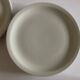 Set of 7 Scandinavian modernist flat plates in ivory earthenware