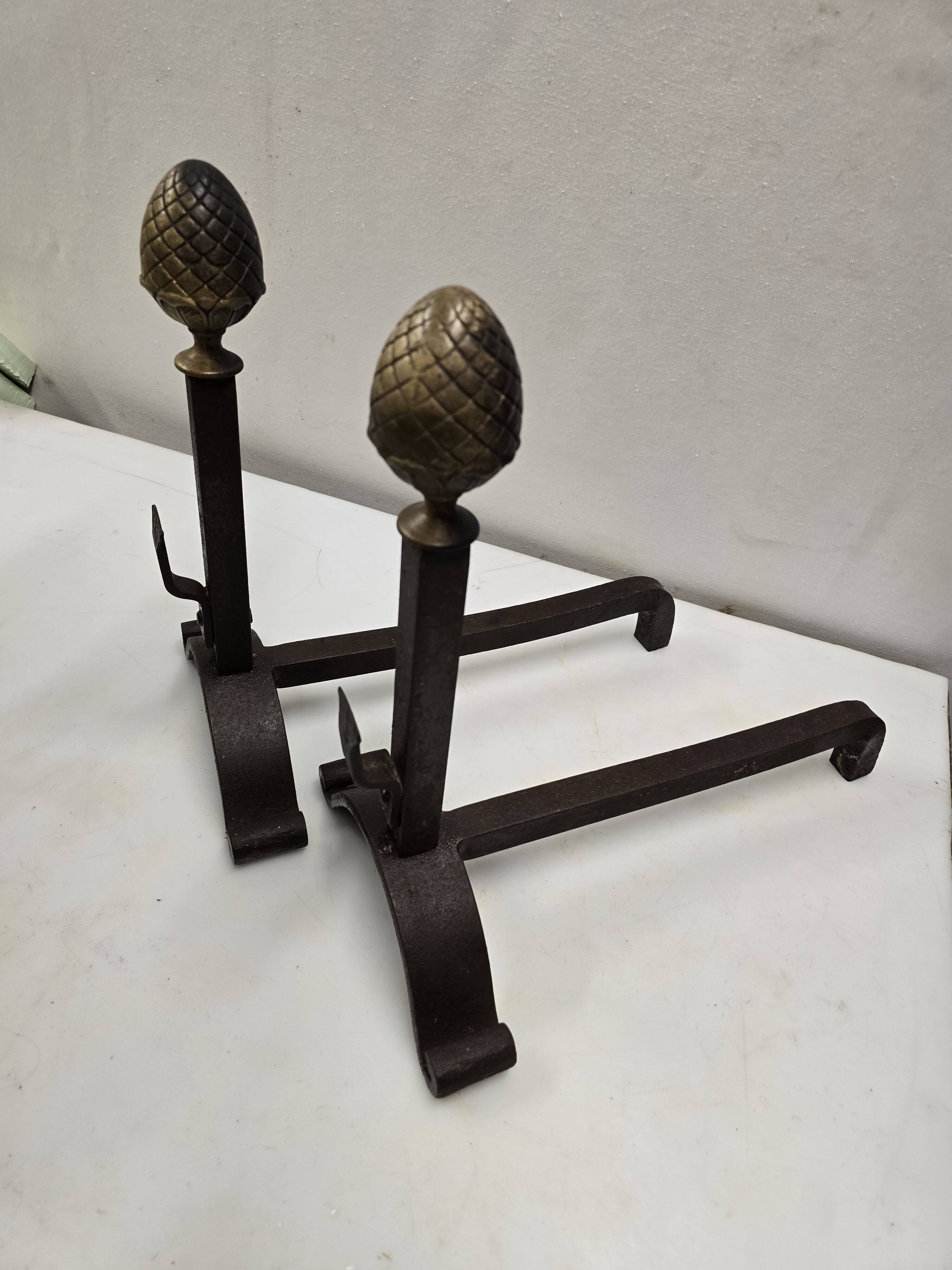 Old pair of wrought iron and bronze andirons