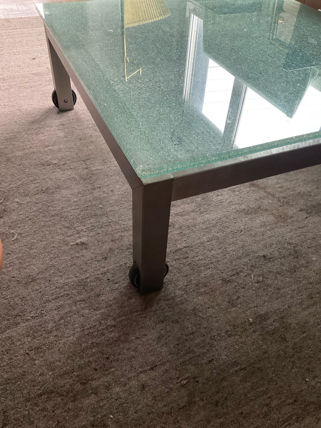 Designer garden coffee table in tempered glass and stainless steel