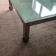 Designer garden coffee table in tempered glass and stainless steel