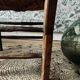 Fauteuil vintage en bois et assise paillée