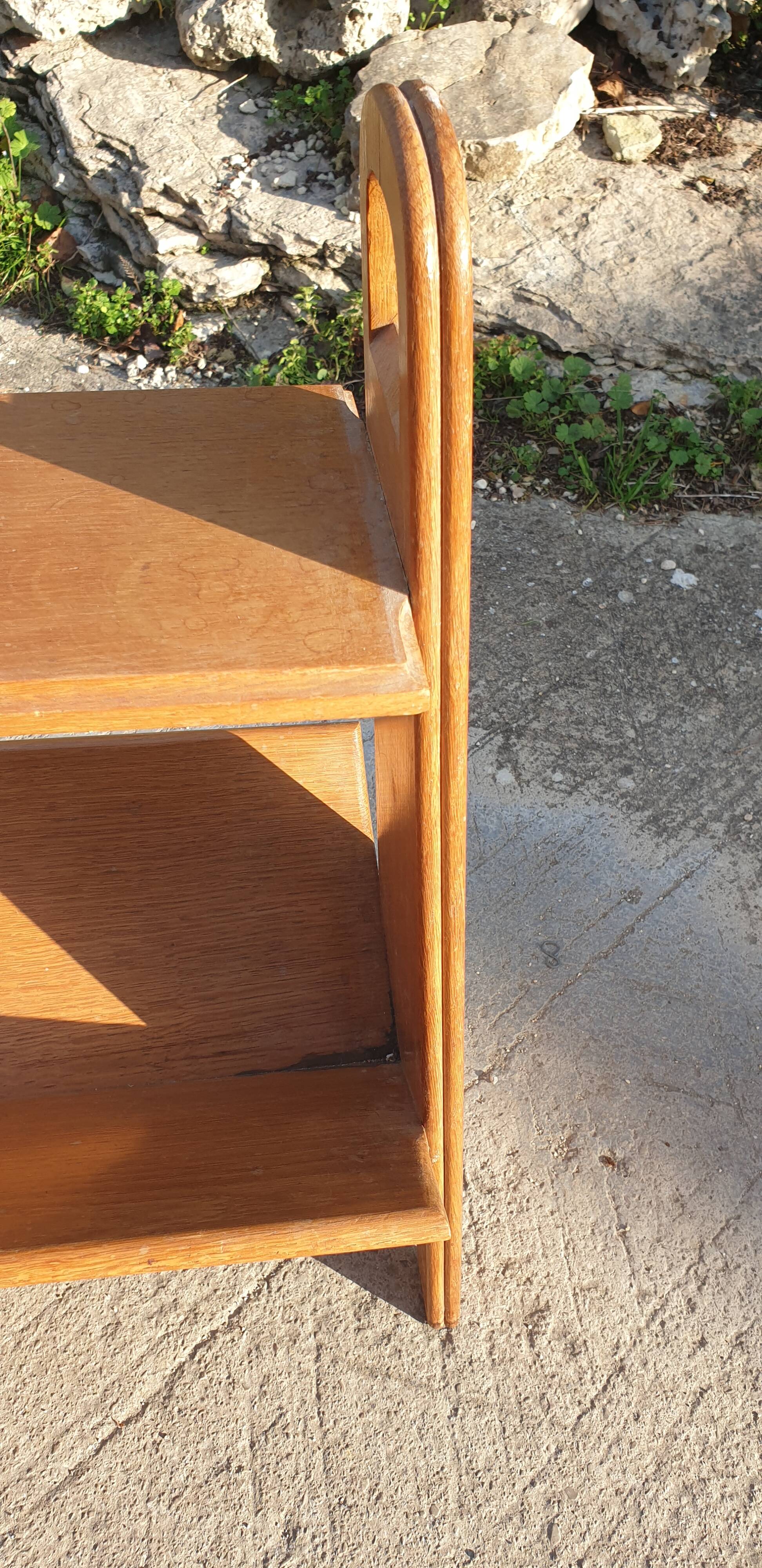 Magazine rack with sliding drawers in light wood, Scandinavian style.