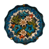 Decorative flower plate in reliefs