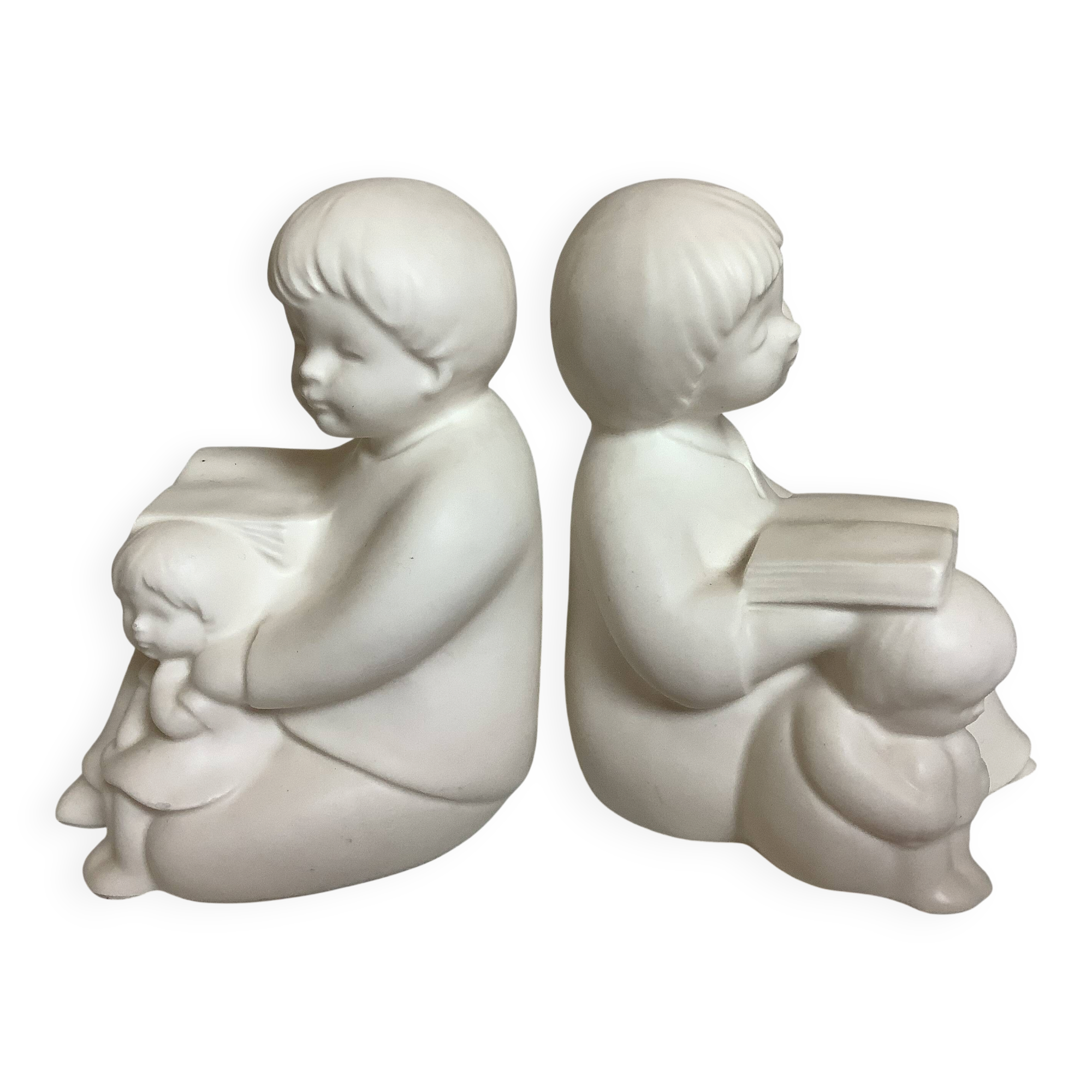 Pair of bookends with a matte white glaze for children.
