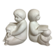 Pair of bookends with a matte white glaze for children.