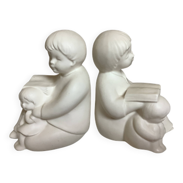 Pair of bookends with a matte white glaze for children.