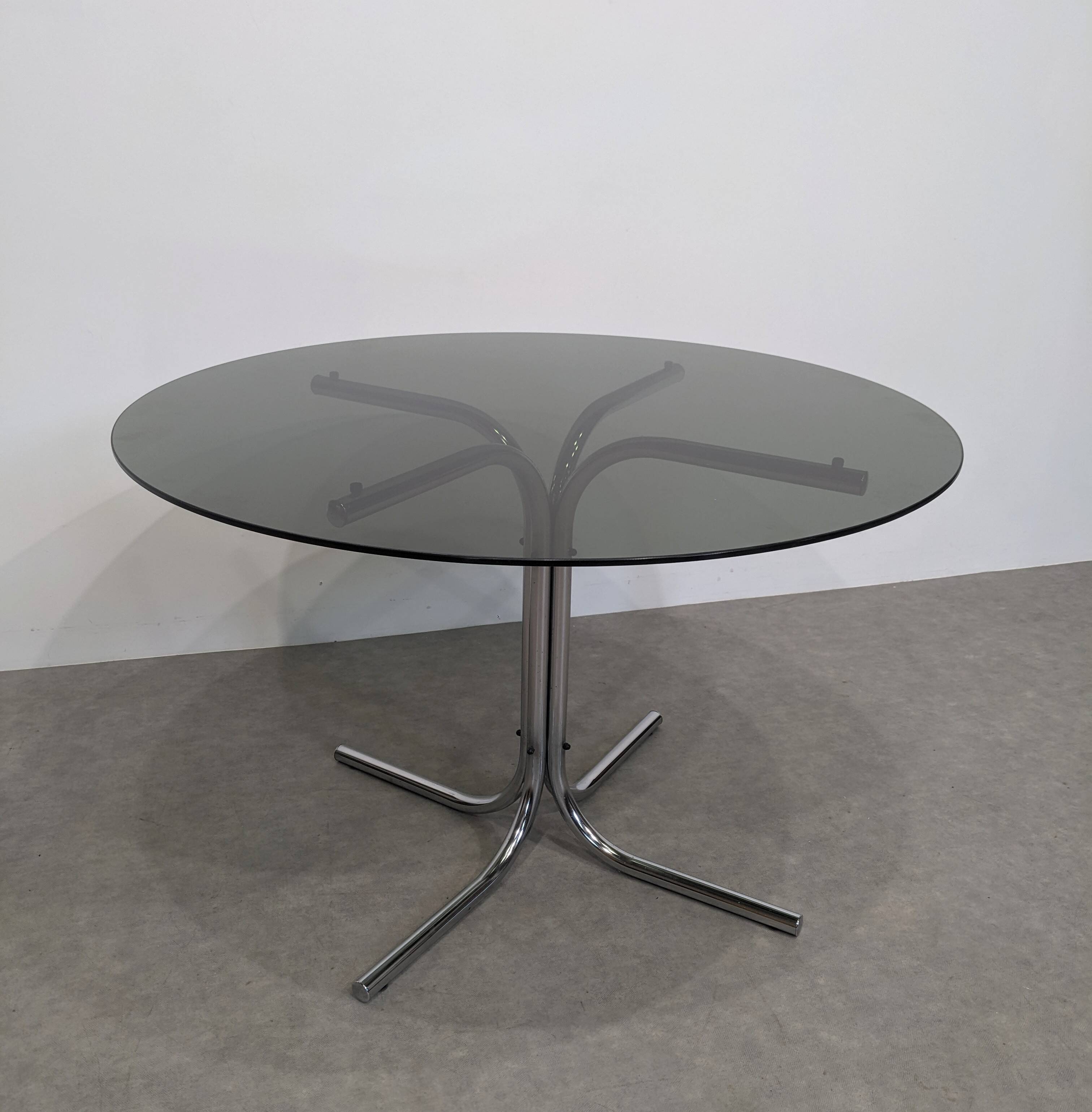 70s round table with smoked glass and chrome
