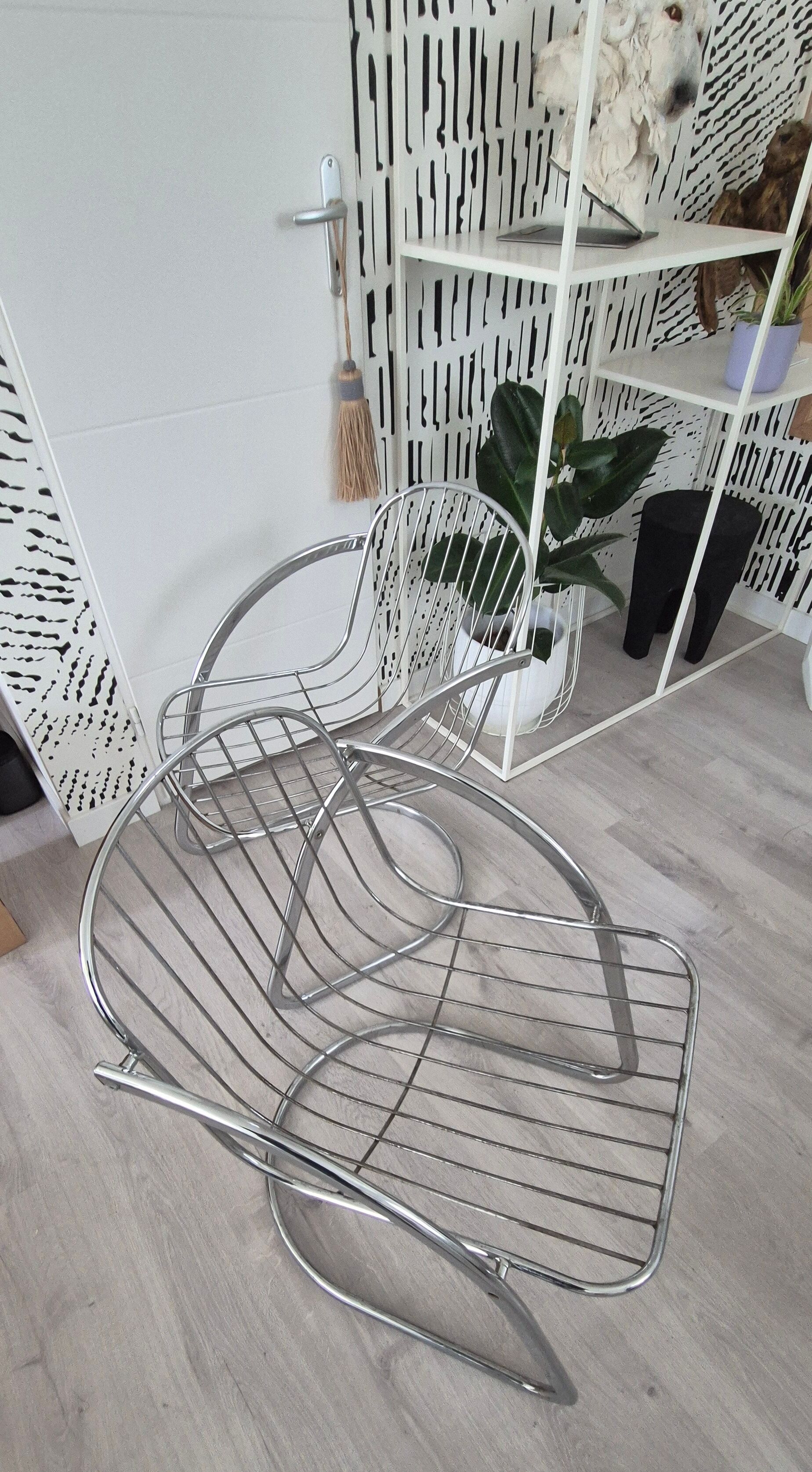 A pair of space age wire chairs
