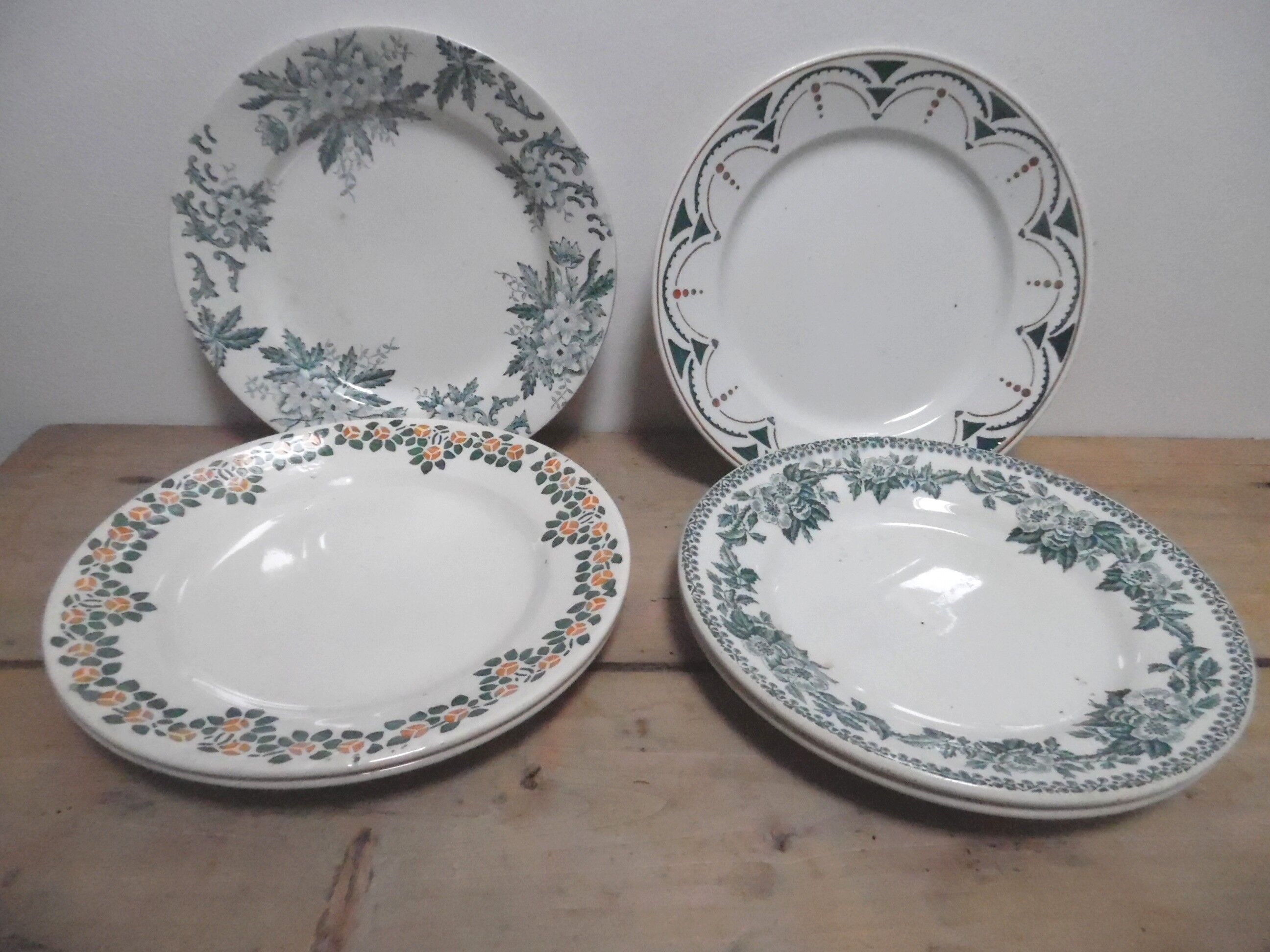 six plates mismatched earthenware