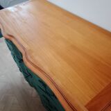 Dark green patina crossbow chest of drawers