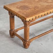 Brutalist coffee table in solid oak, metal, and patinated leather, 1940s.