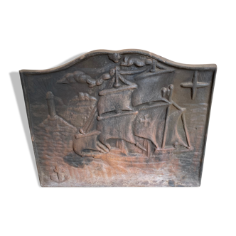 Cast iron fireback with a boat theme