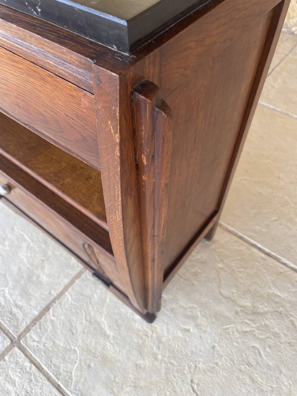 Art Deco bedside table in walnut, black marble top, circa 1920.