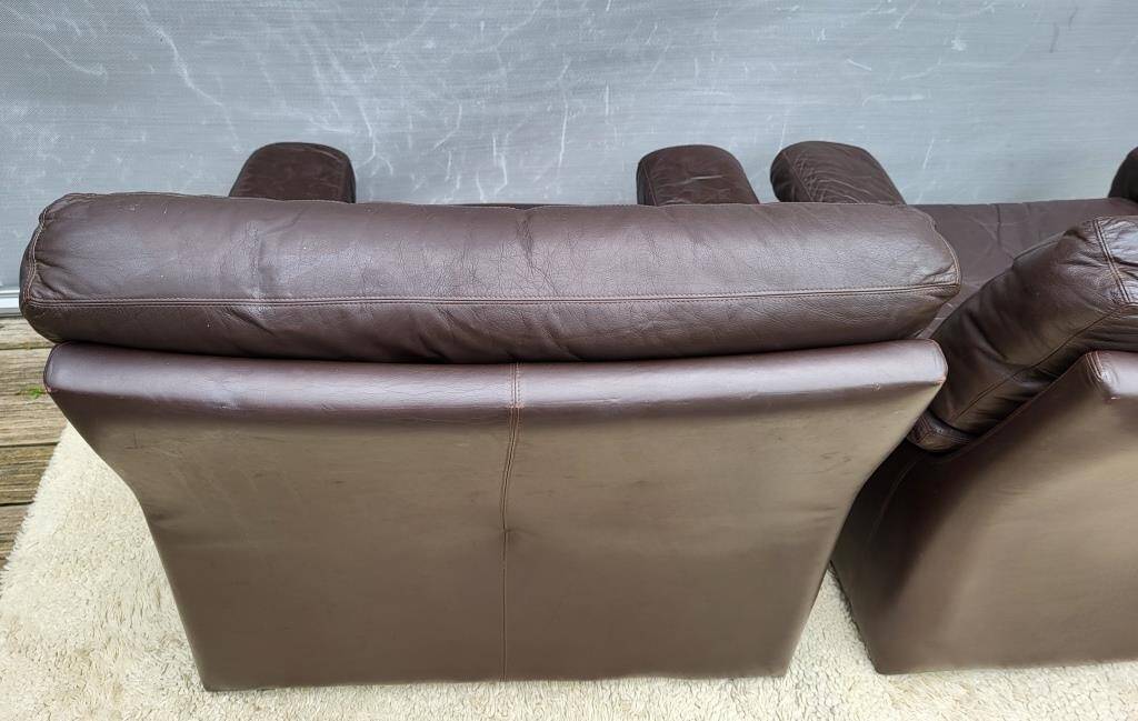 Pair of chocolate leather lounge chairs