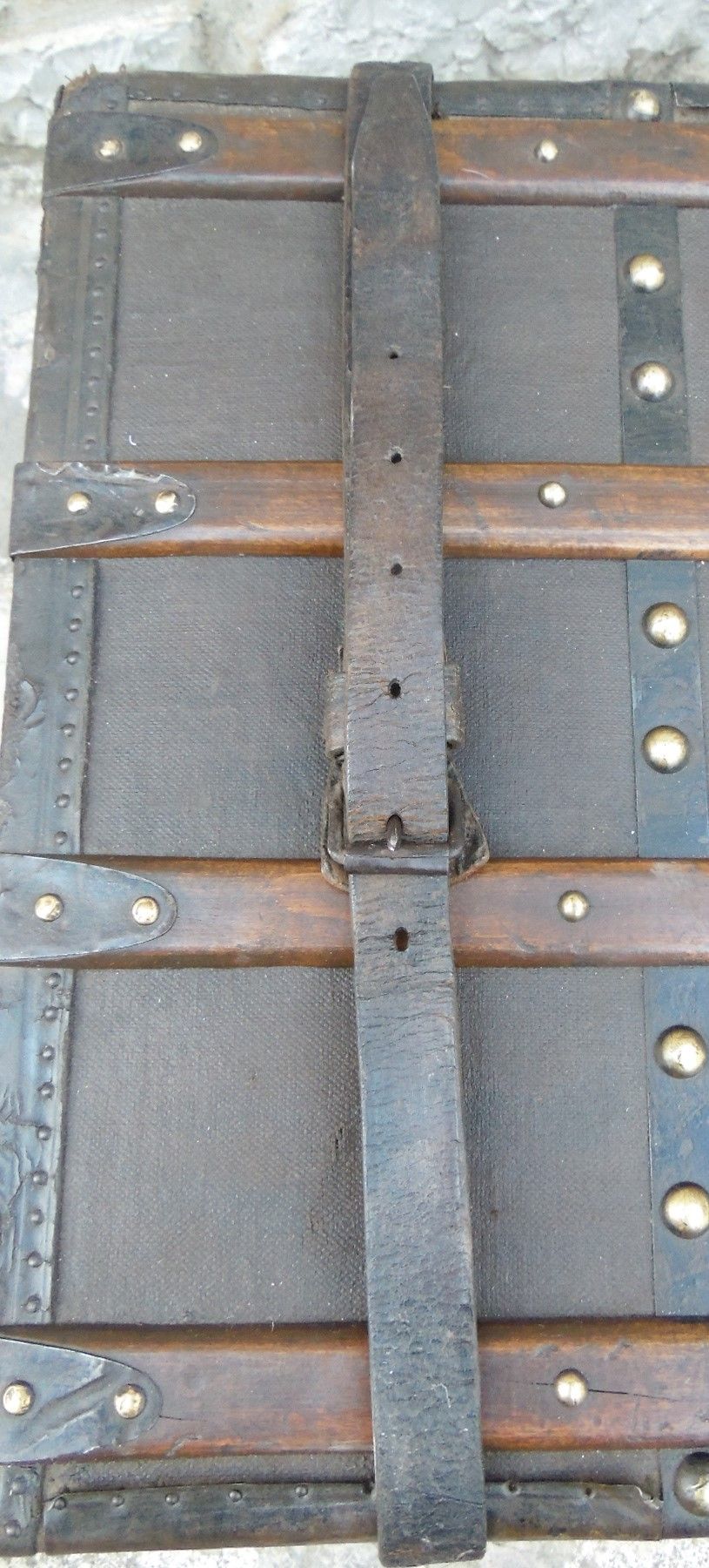 Old wooden and leather trunk, old brass nail trunk and leather strap