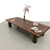 Modernist coffee table in solid elm, cylindrical pine base, 1970s.