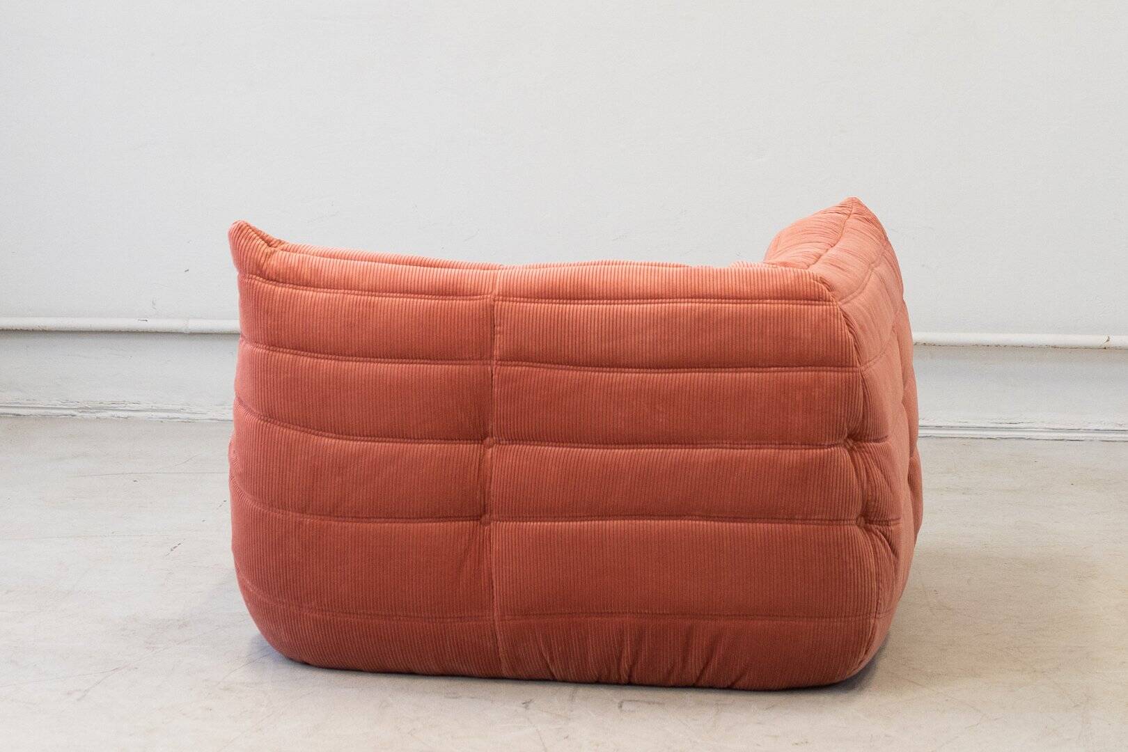 Coral corduroy Togo corner chair by Michel Ducaroy for Ligne Roset