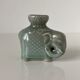 Porcelain candle holder and celadon cover in the shape of an elephant