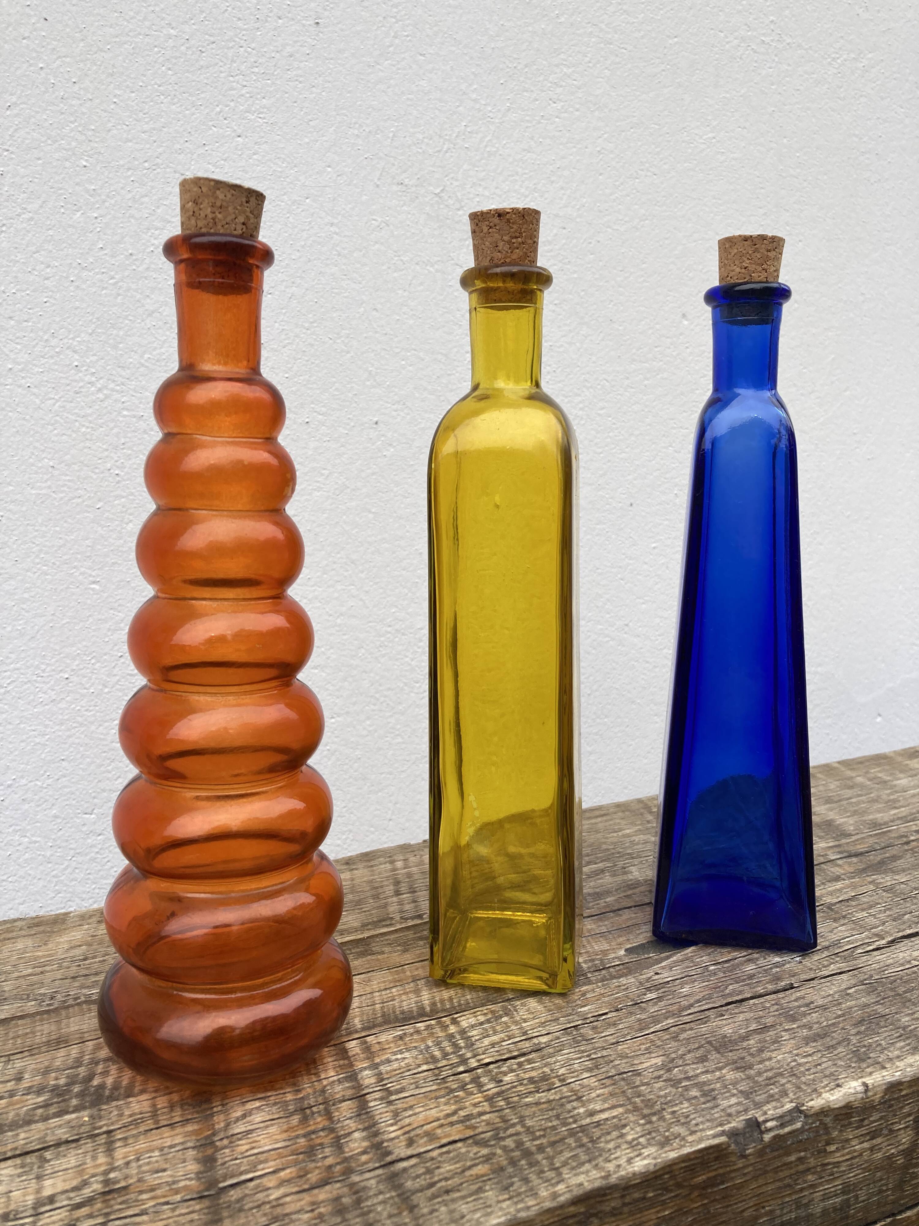 Trio of bottles 1970 color orange yellow and blue geometric shape