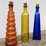 Trio of bottles 1970 color orange yellow and blue geometric shape