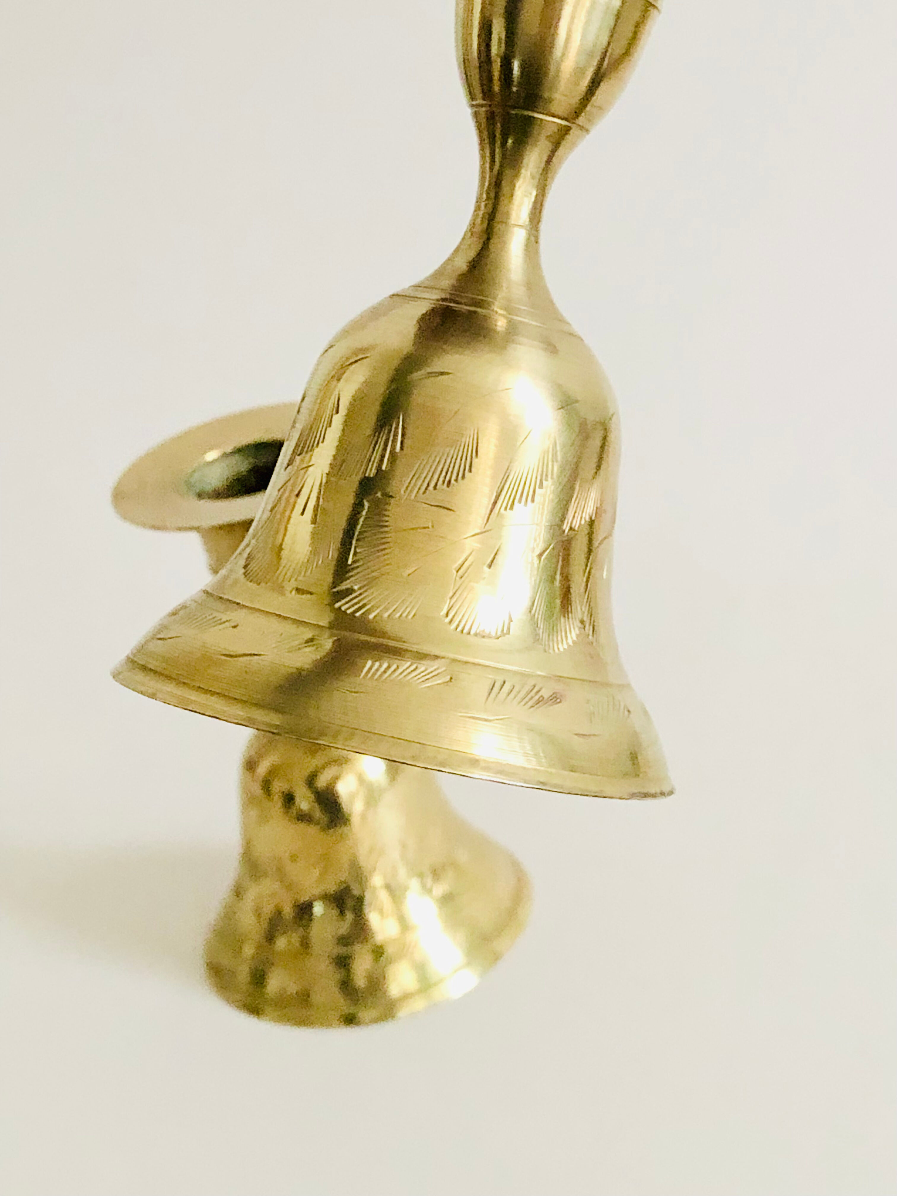 Pair of brass "bell" candle holders