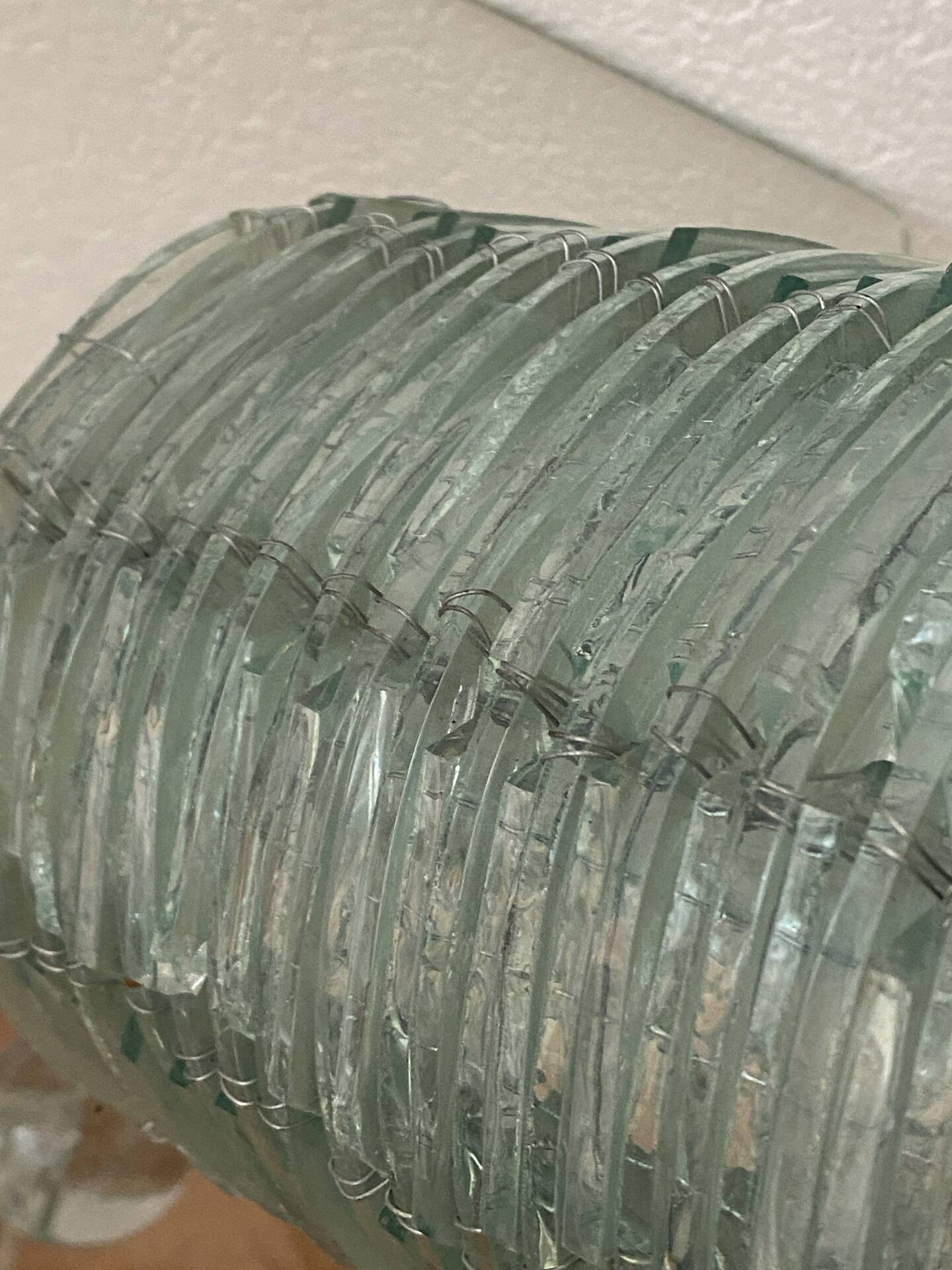 Blue-tinted glass lamp and wire.