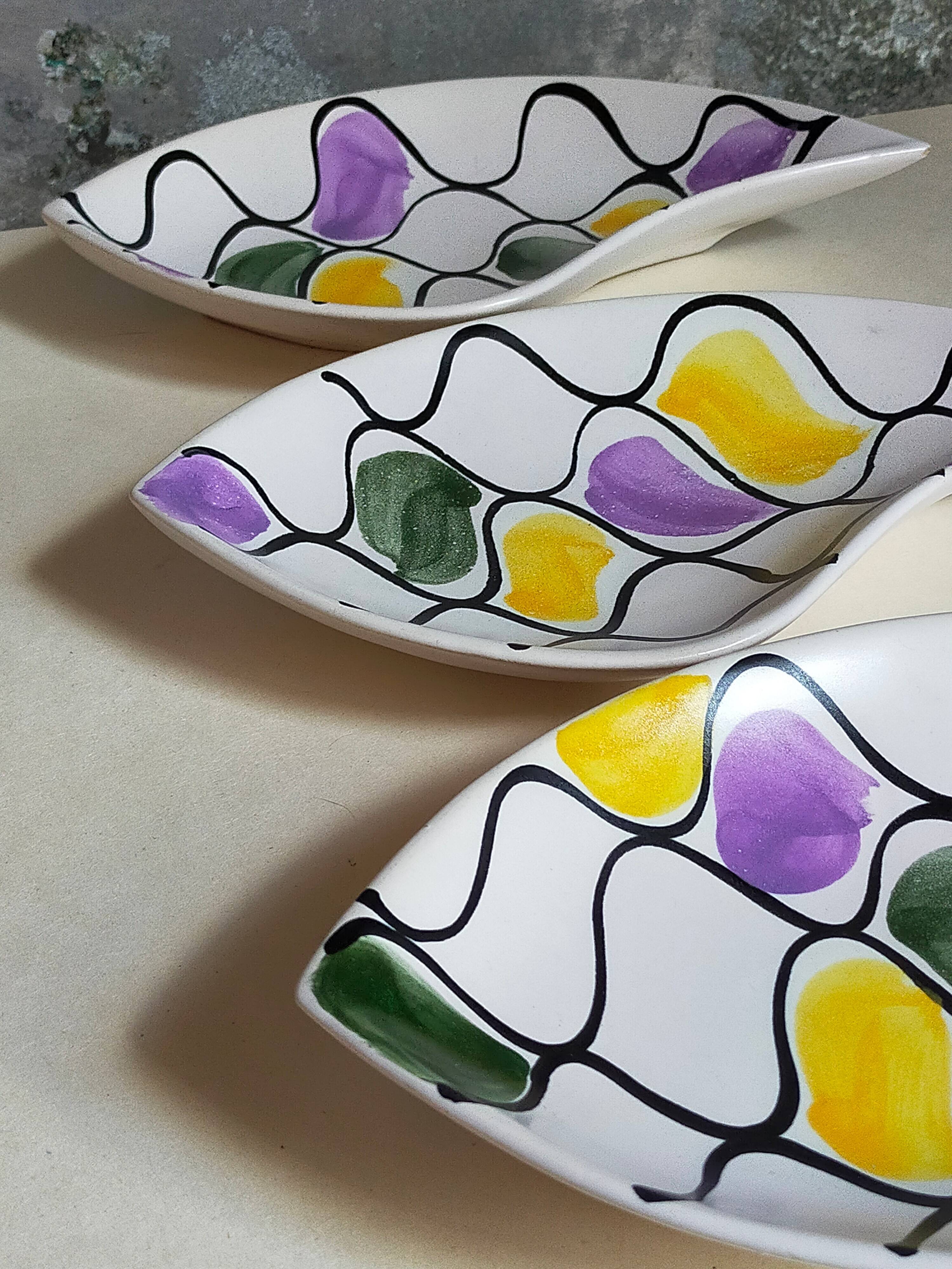 Three vintage free-form ceramic ravine dishes from the 1950s
