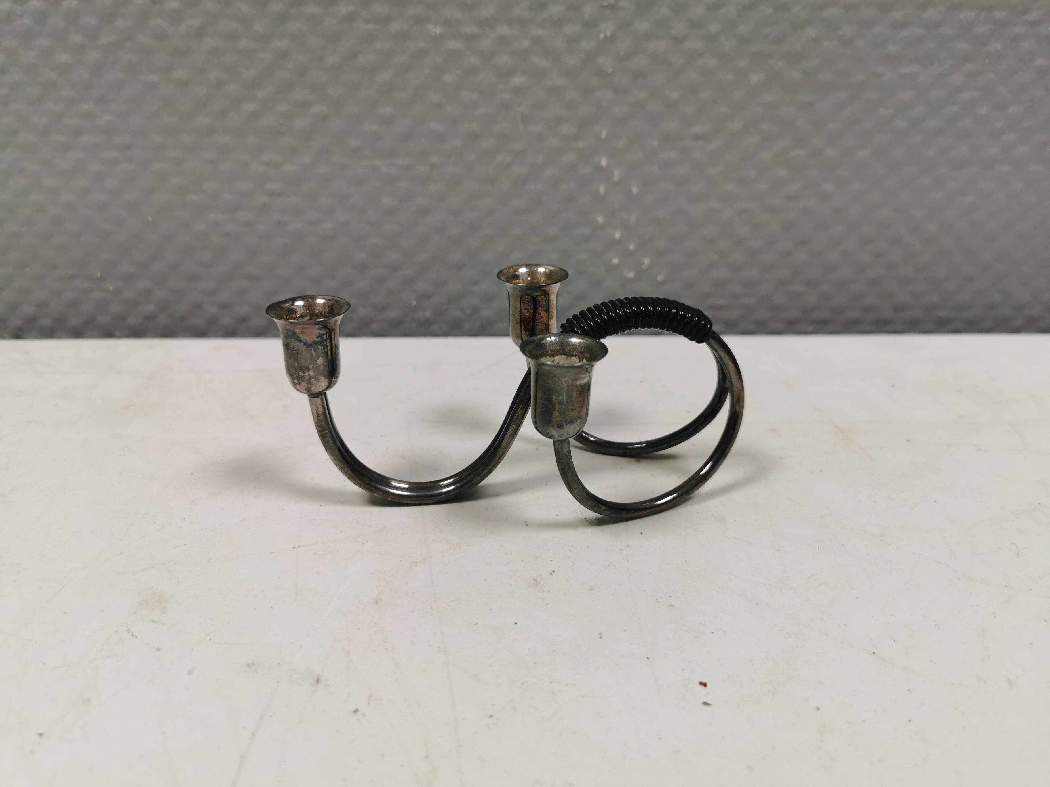 Small candle holder in tarnished silver, with place for three small candles