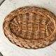 trio of woven rattan and bamboo baskets from the 60s and 70s