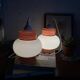 Pair of pendant lights with white glass shades from the 1950s.