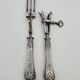 Set of serving forks and silver-plated leg of lamb fork.