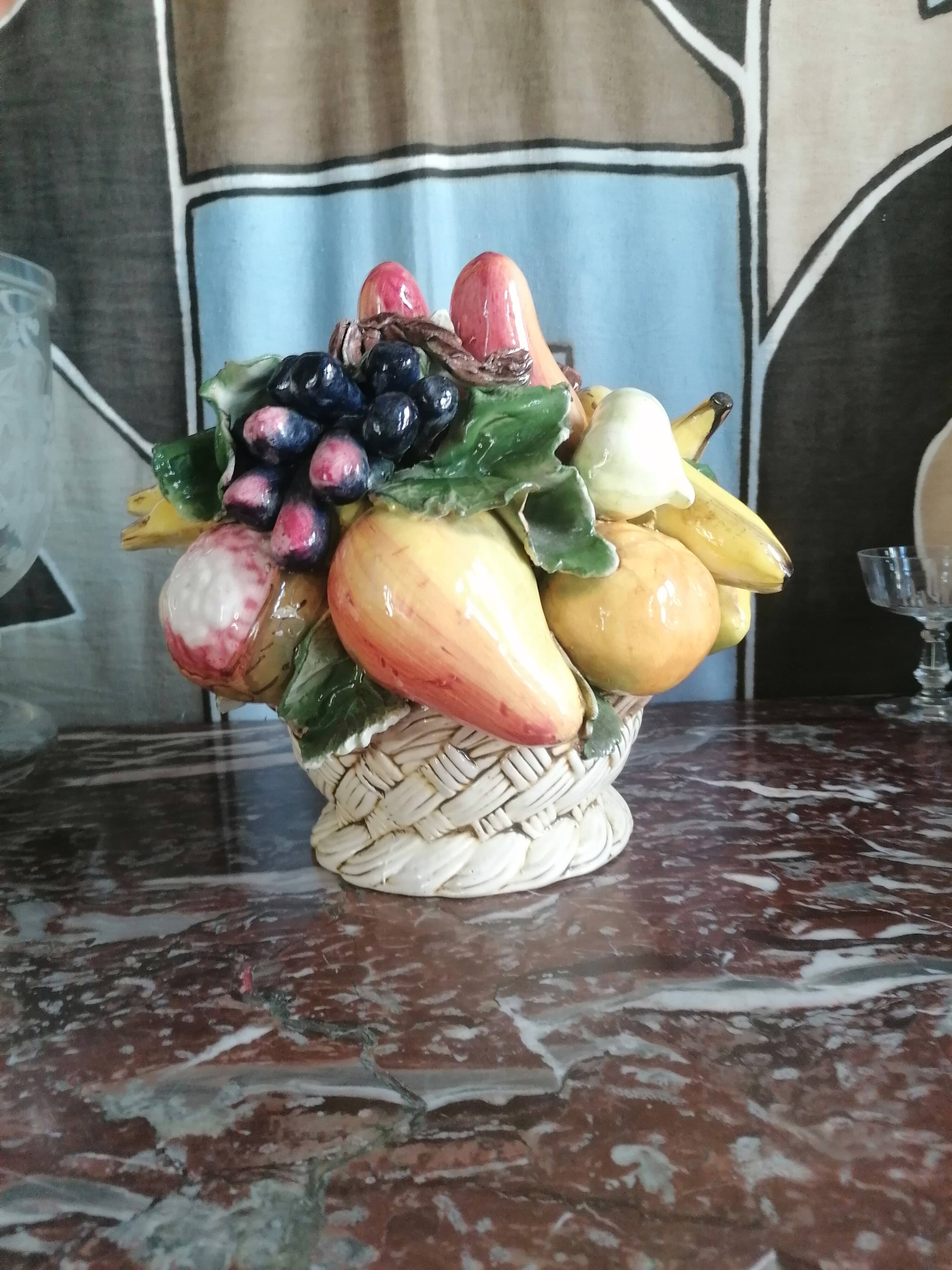 Basket with ceramic fruit decoration