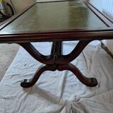 Living room coffee table with green leather and wood top