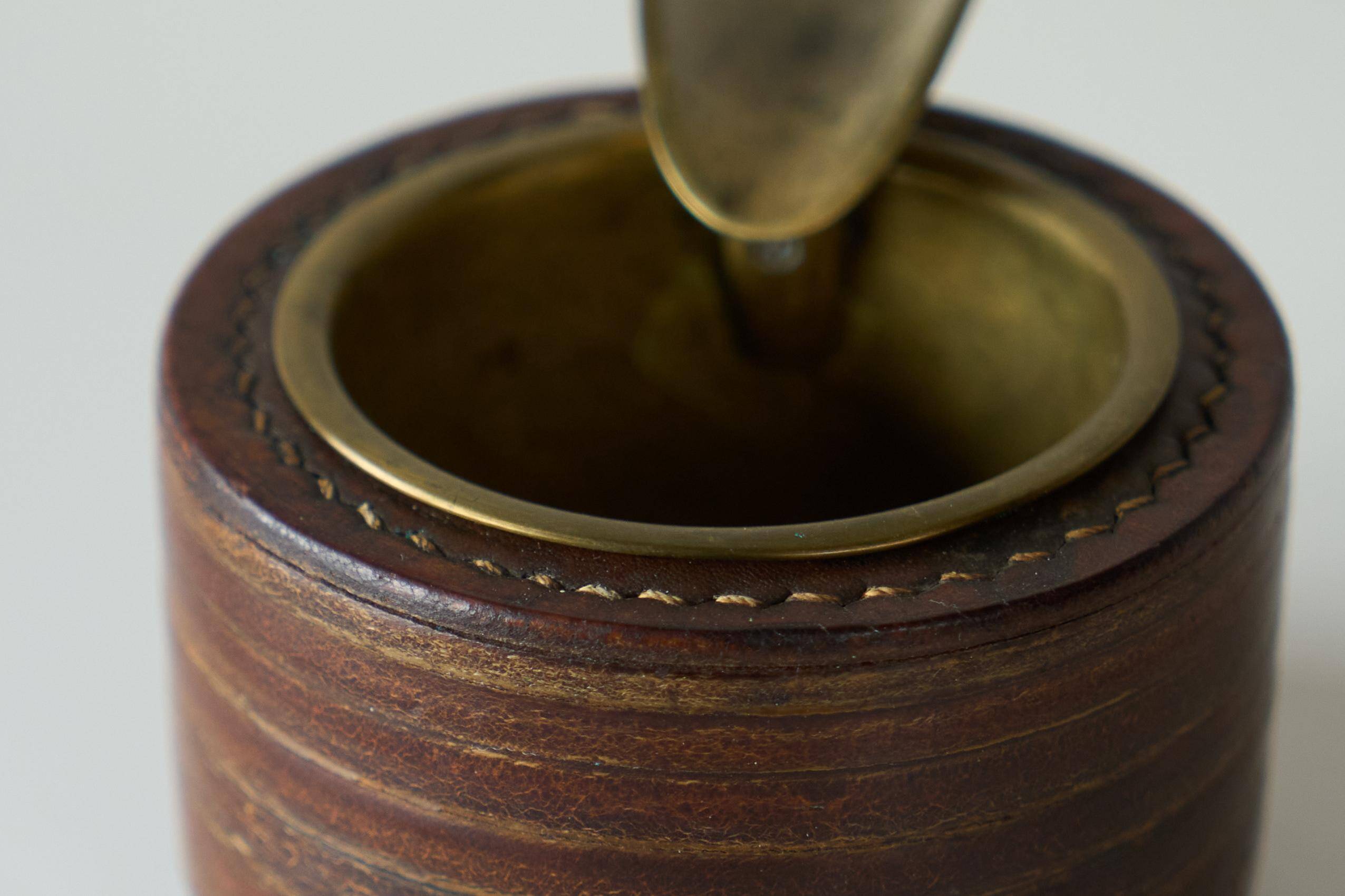 Vintage leather and patinated brass ashtray, 1960s, mid-century design.