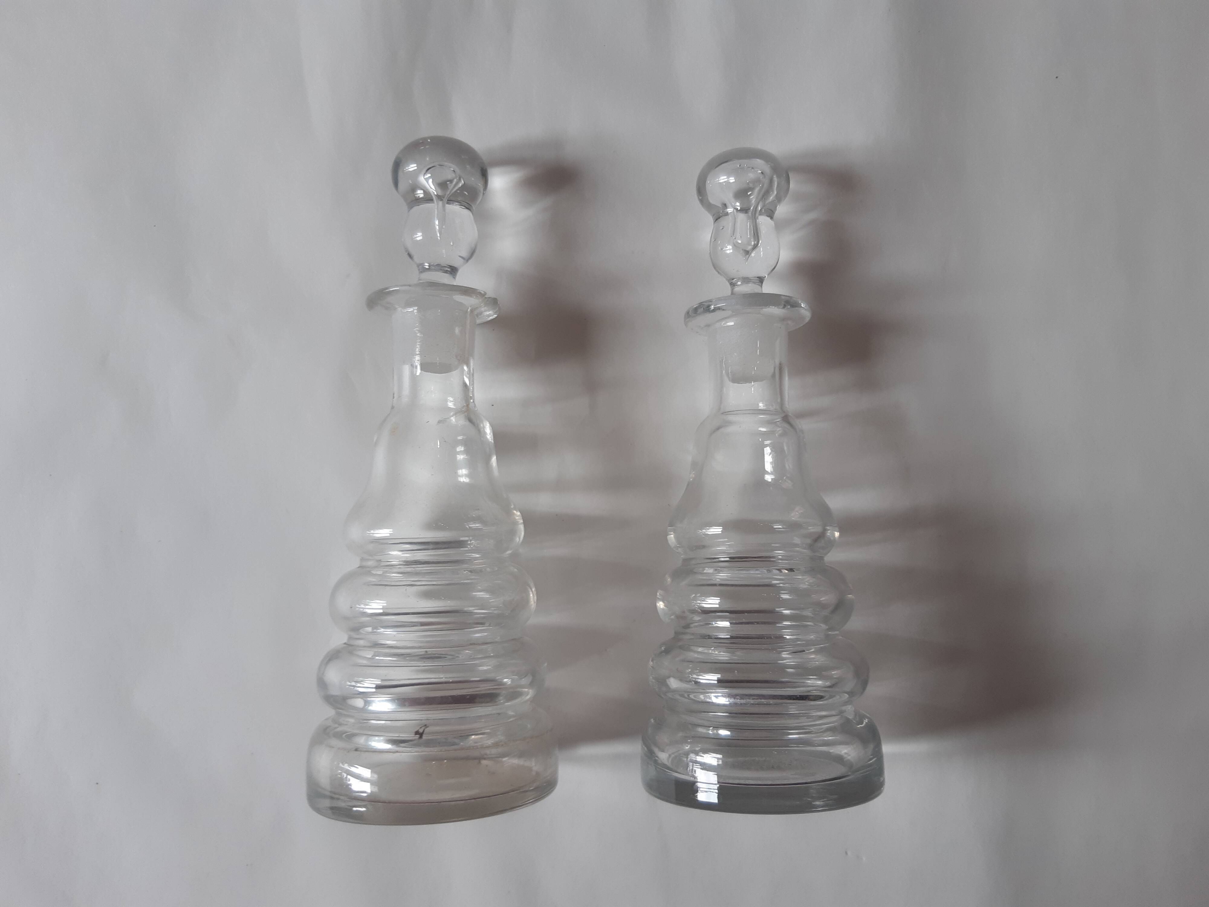 Set of two oil and vinegar glass cruets.