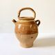 Old ochre and yellow glazed ceramic jug / goat
