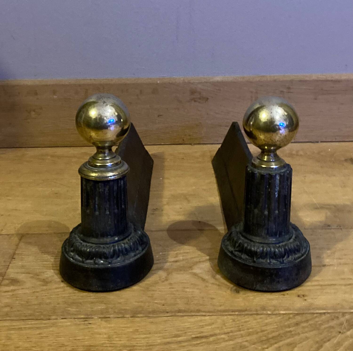 Pair of Napoleon III andirons from the 19th century in cast iron and brass