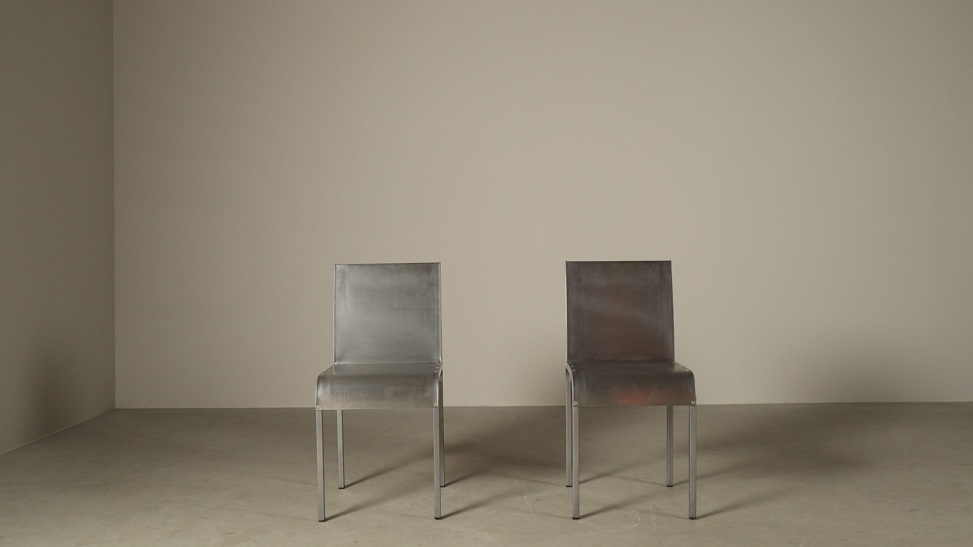 Set of six postmodernist stainless steel dining chairs from circa 1980-1990.