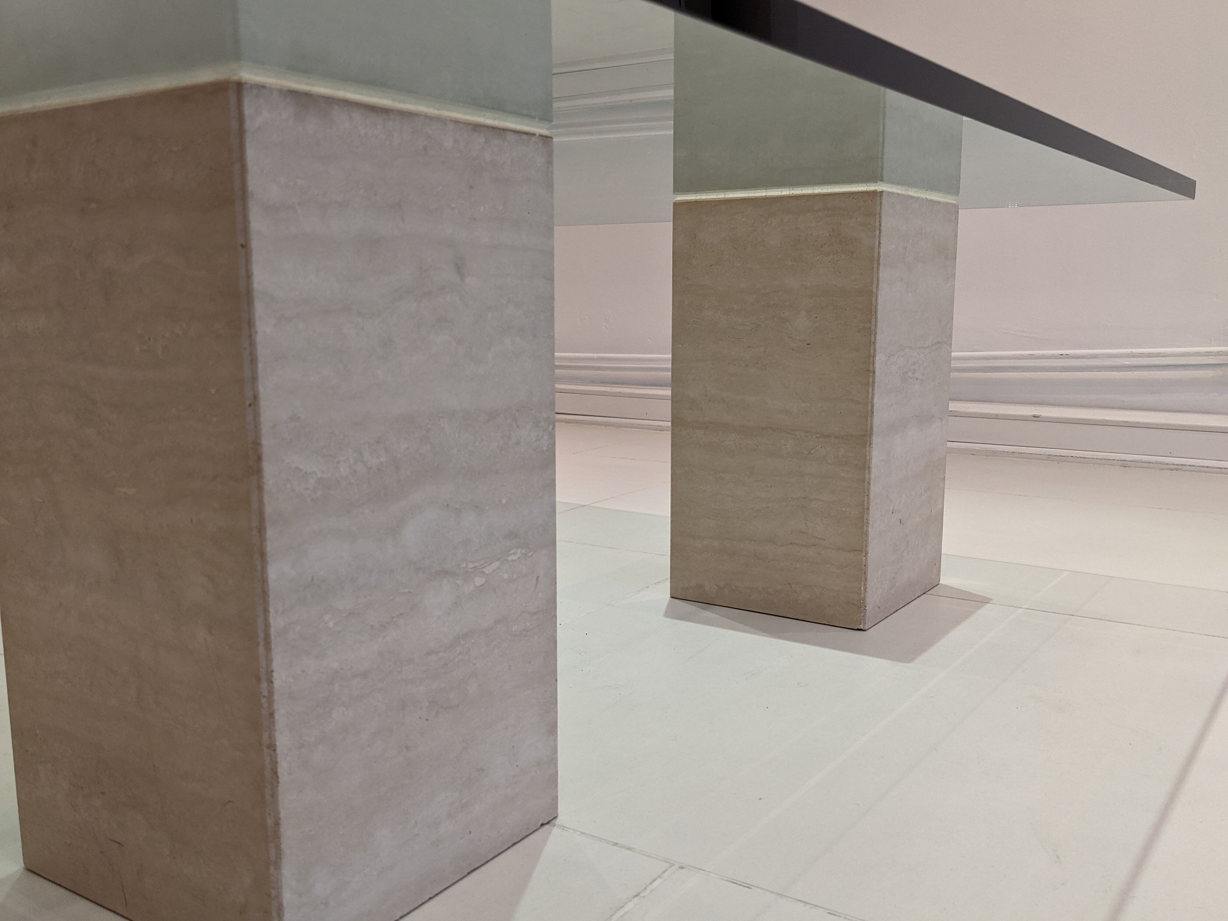 Glass table and travertine feet