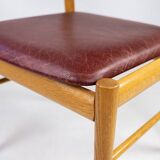 Suite of six chairs in oak and leather