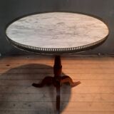 Gueridon circulaire dessu marbre blanc