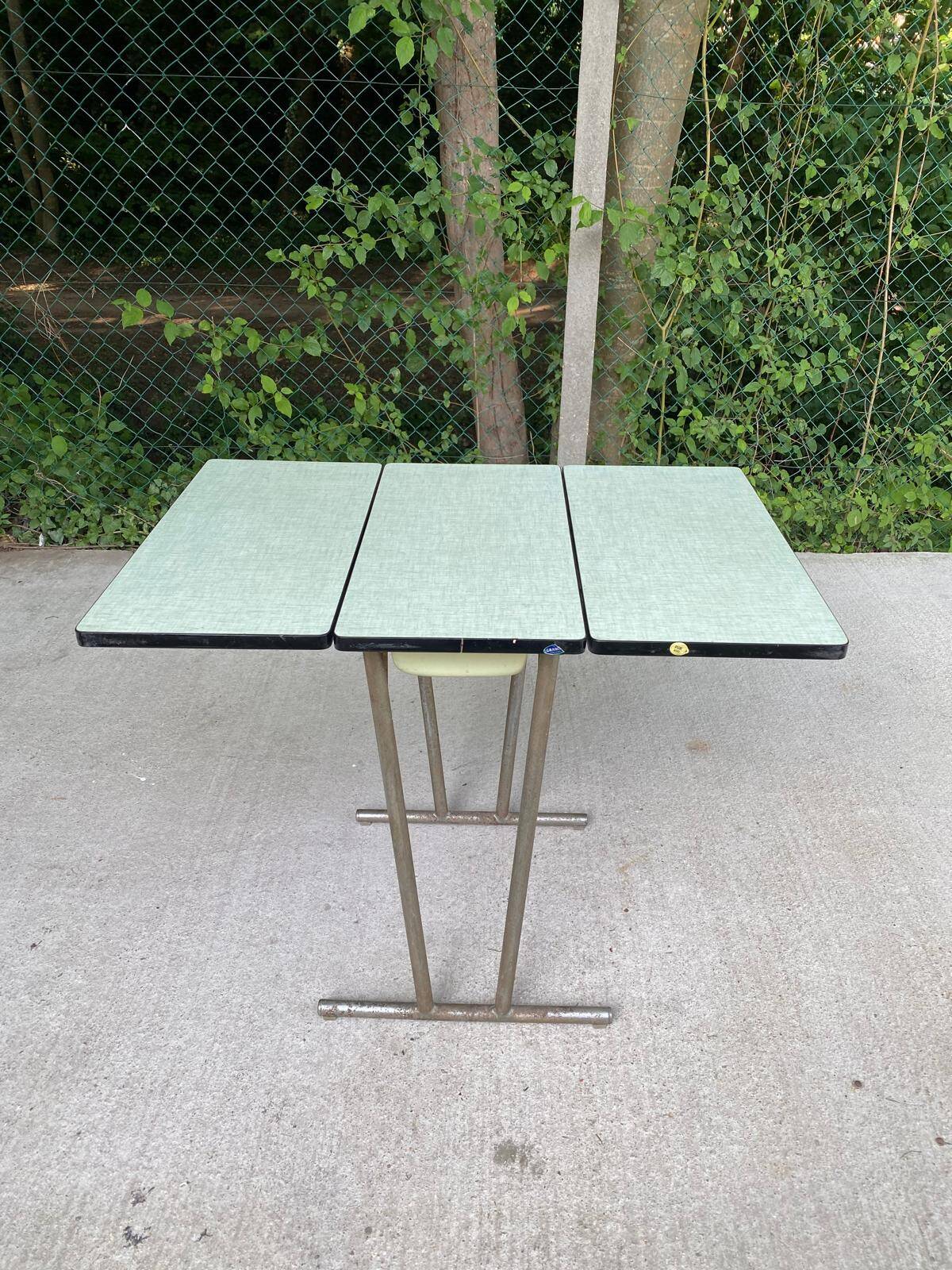 Folding and extending kitchen table in steel and aqua green wood