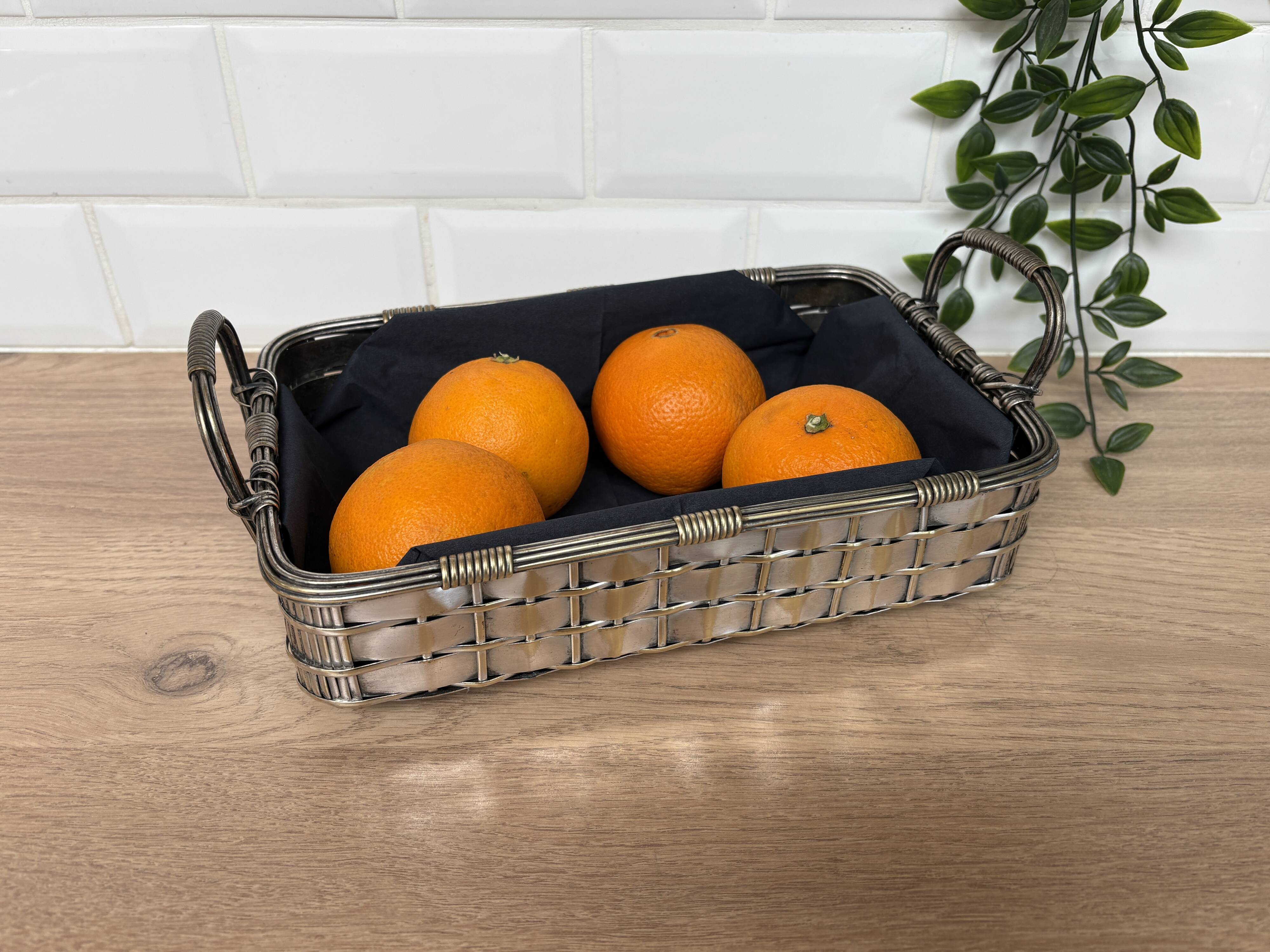 Woven silver-plated metal basket.