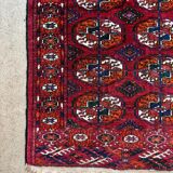 Bukhara rug with 12 panels in wool and burgundy silk, 88 x 54 cm.