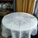 Round off-white tablecloth embroidered with grey flowers with 8 matching napkins - festive table