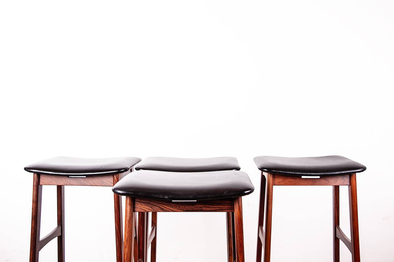 4 Danish high stools, rosewood and black leather, Knud Bent for Dyrlund.