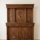 Large antique wooden sideboard carved in rustic style.
