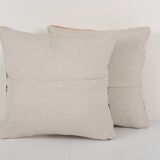 Set of two muted ecru carpet rug pillows
